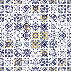 Wallpaper featuring a seamless pattern of blue and yellow square ornamental designs on a white background. Ceramic Portugal tiles. Decorative wall ornament in exterior and interior