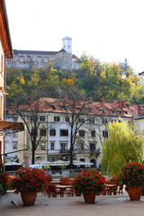 Wall Mural - Picturesque historical buildings in central Ljubljana, capital of Slovenia. Autumnal foliage on the trees.