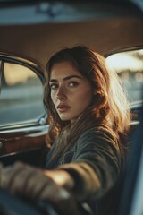 Poster - A woman sits comfortably in the driver's seat of a car, ready for a drive
