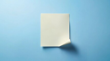 Poster - A blank sheet of white paper rests on a bright blue surface, perfect for writing or note-taking