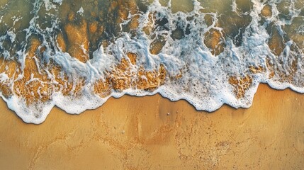 Poster - Aerial view of a beach with a wave approaching the shore