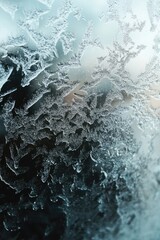 Canvas Print - A close-up shot of a frost-covered window with intricate ice patterns and winter wonderland atmosphere