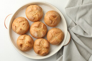 Sticker - Baking dish with homemade tasty buns on white table, top view