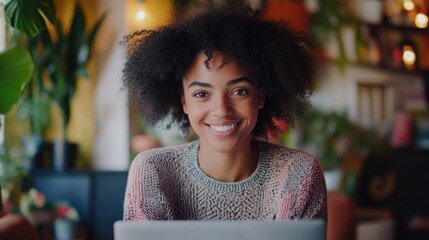 Poster - A smiling woman sits in front of a laptop computer, typing away