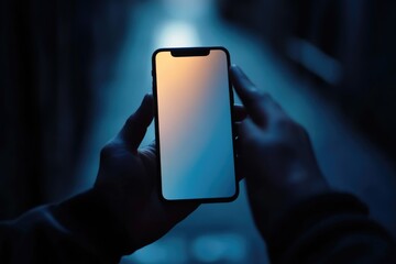 Aufkleber - A person holds a cell phone in their hand, ready to use