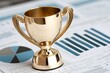 © Anurak - Golden Trophy on Financial Charts.