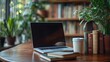 © thanawat - A cozy workspace featuring a laptop, books, and a coffee cup surrounded by green plants, perfect for productivity and inspiration.