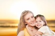 © BillionPhotos.com - Smiling young happy mother and beautiful child at the beach