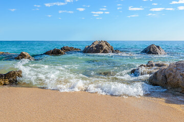 Different stages of the fantastic ocean waves. Rocky and sandy beach. Santa Maria Beach, Cabo San Lucas, Mexico.