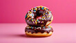 © Galeno - chocolate donuts sprinkles pink background sweet glazed treat colorful toppings