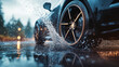 © Taras Vykhopen - Close-up shot of car wheels splashing water on wet asphalt during a rainstorm