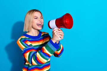 Sticker - Profile photo of nice young woman communicate loudspeaker wear striped sweater isolated on blue color background