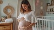 © Loki Studio - Pregnant woman in a light floral blouse, smiling while gently holding her baby bump, standing in a soft-lit nursery room with a crib in the background