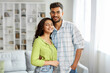 © Home-stock - Portrait of young romantic indian couple embracing and smiling, enjoying time together, free space
