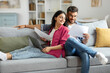 © Home-stock - Happy indian couple checking documents, spouses reading insurance agreement or property certificate