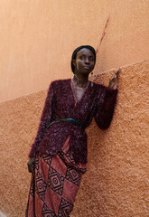 portrait of a black female model in stylish looks, street photography, national clothing.