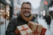 © Georgii - Happy man in winter clothing holding wrapped gifts outdoors in snowy city during holiday season with a joyful smile on his face