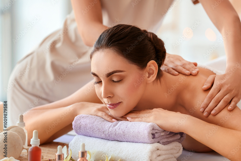 Young woman getting massage in spa salon, closeup