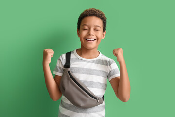 Canvas Print - Happy little African-American boy on green background