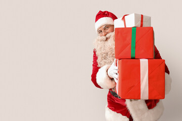 Wall Mural - Santa Claus with Christmas gifts on white background