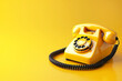 © Nazlykhan - Retro yellow rotary phone on a vibrant yellow background