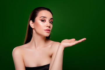 Photo of stunning passionate lady advertising accessory empty space isolated on green color background