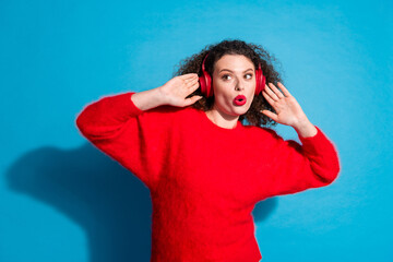 Poster - Photo portrait of attractive young woman headphones listen music dressed stylish red clothes isolated on blue color background