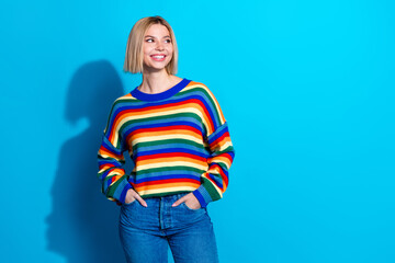 Canvas Print - Photo of nice young woman look empty space wear striped sweater isolated on blue color background