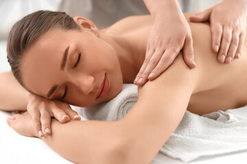 Poster - Beautiful young woman getting shoulder massage in spa salon, closeup