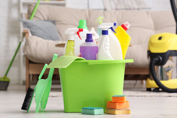 Sticker - Bucket with cleaning supplies on floor in living room