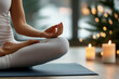 © SnapVault - A peaceful person meditating on a yoga mat with hands in a mudra gesture. Lit candles and a softly lit background evoke a calming atmosphere, perfect for yoga, meditation, and relaxation.