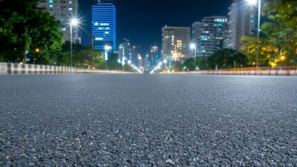 Sticker - A city street at night with a large building in the background