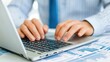© Naree - Modern Consultant Working on Detailed Project Plan with Laptop