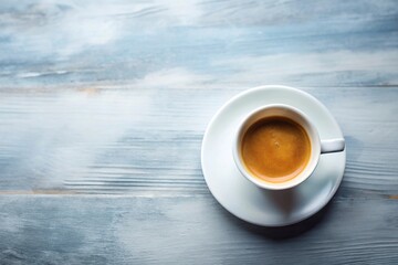 Espresso coffee in white cup on aerial background