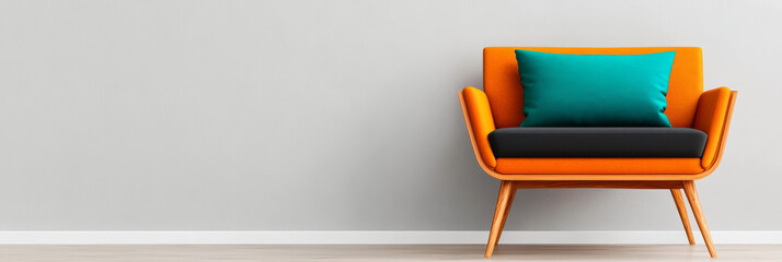 Sticker - Orange armchair with a teal pillow against a white wall.