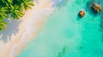 Aerial view of tropical beach featuring crystal clear turquoise water, soft white sand, and lush palm trees. serene landscape evokes sense of tranquility and paradise