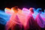 Group of people posing with light painting effect at night