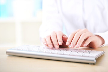 Poster - Female hands typing on computer keyboard