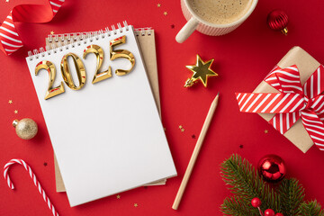 Sticker - Overhead view of a 2025 new year concept with a notebook, decorations, and gift on a red background