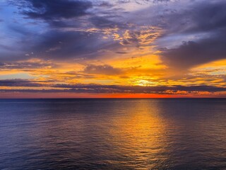 Wall Mural - Colorful sunset sky clouds and calm sea at evening.