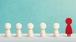 © MP-AI - Empowering employee development, this features group of wooden figures, with one red figure standing out, symbolizing leadership and individuality