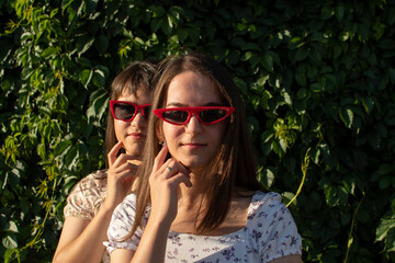 portrait of a two young woman in sunglasses