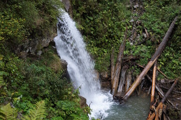 Poster - A beautiful waterfall in a mountainous and wooded area. Mendelikha Park.