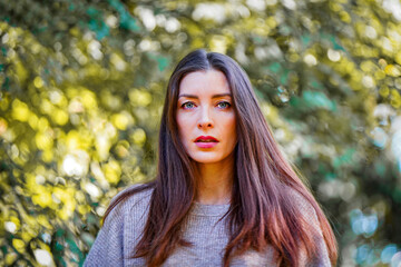 Wall Mural - portrait of a woman in the forest in autumm