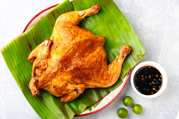 Pinoy Crispy Roasted Chicken plated in Banana Leaves