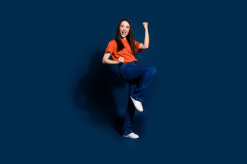 Sticker - Photo of lovely glad cheerful woman wear stylish orange outfit yes win isolated on dark blue color background