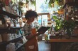 © Luxetify - A young woman wearing an apron reads a book in a plant shop.