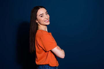 Poster - Photo of lovely adorable positive woman wear stylish clothes folded arms empty space isolated on dark blue color background