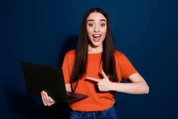 Canvas Print - Photo of excited lovely cheerful woman wear stylish clothes recommend buy discount device isolated on dark blue color background