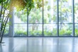© MahmudulHassan - Blurred empty modern office with big windows and green trees